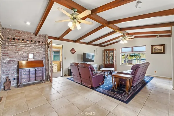 a kitchen with stainless steel appliances granite countertop a sink and a refrigerator