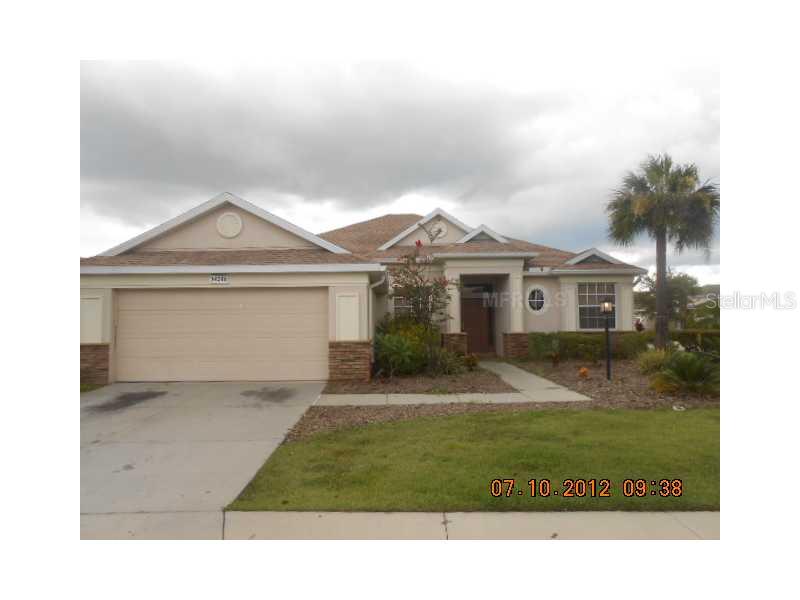 14206 Sundial Place Lakewood Ranch, FL 34202 - Photo 1 of 1 a front view of a house with a yard and garage