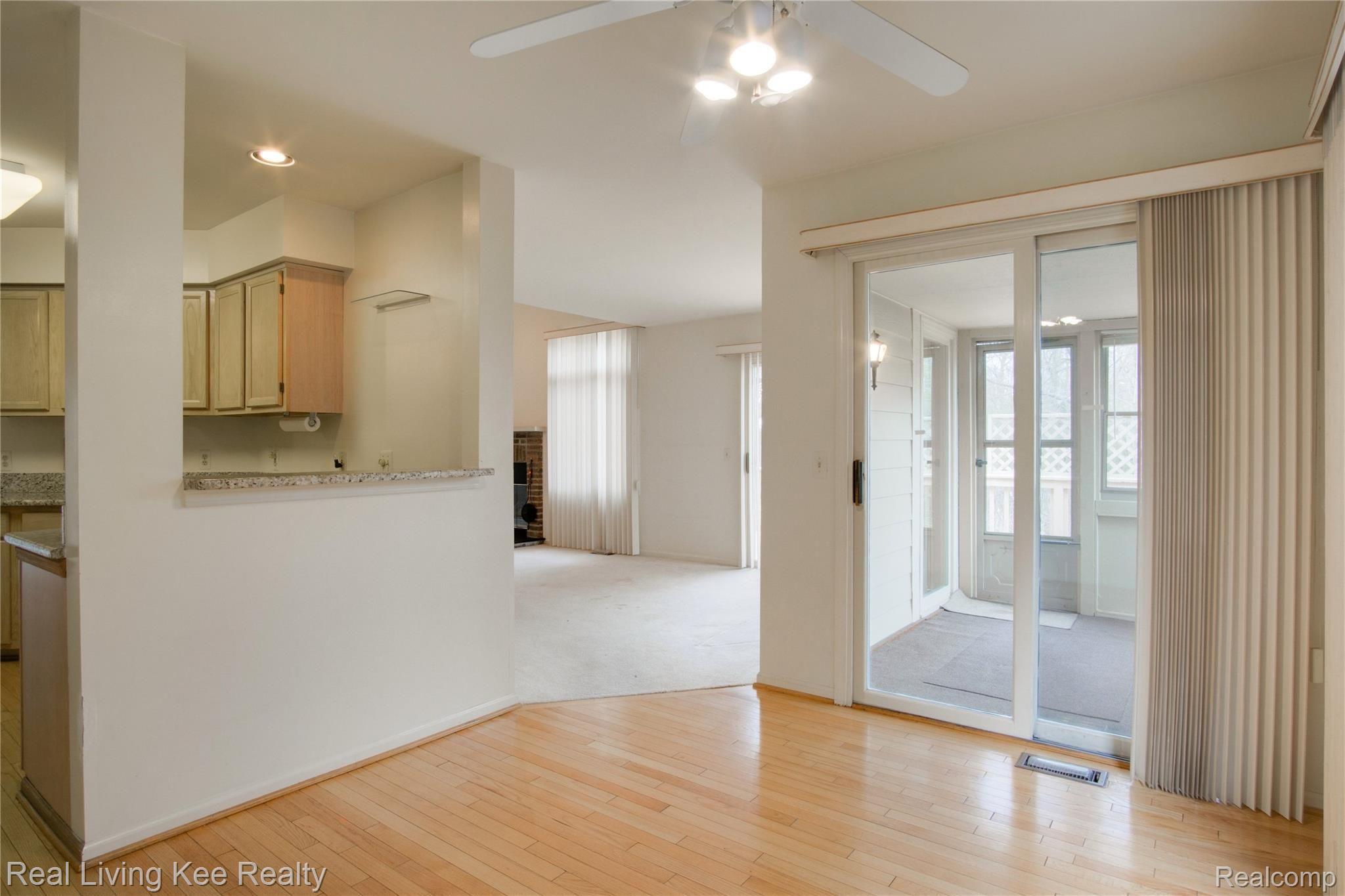 3412 Fairgrove Terrace, Unit 33 Rochester, MI 48309 - Photo 10 of 27 Breakfast room view with doorwall to dining room.jpg