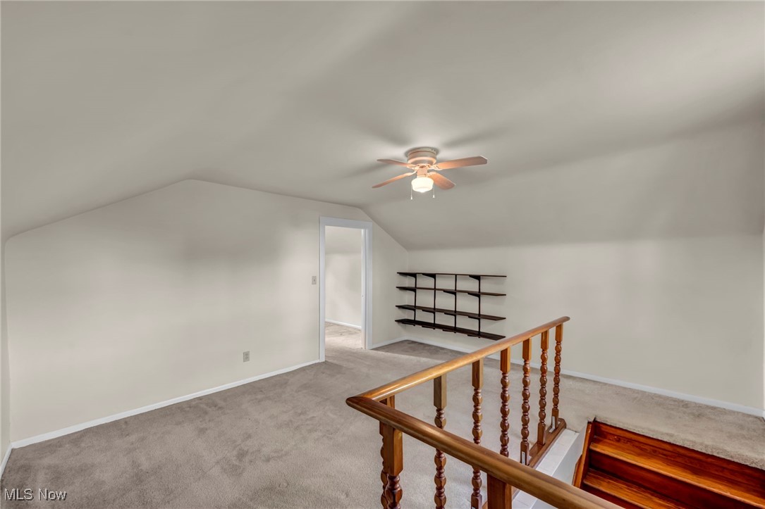 5639 Trumbull Road Geneva, OH 44041 - Photo 23 of 35 Bonus room featuring carpet flooring, vaulted ceiling, and a ceiling fan