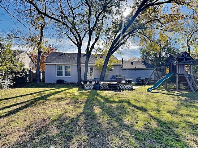 a view of a house with swimming pool and porch