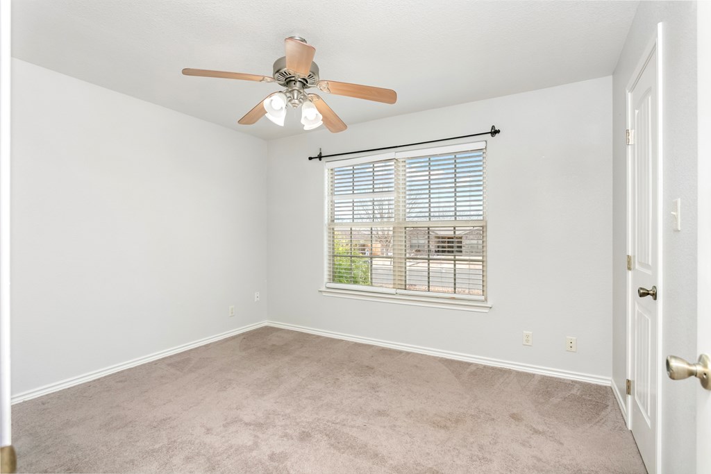 211 Green Oaks Loop Fredericksburg, TX 78624 - Photo 15 of 22 a view of an empty room with a window