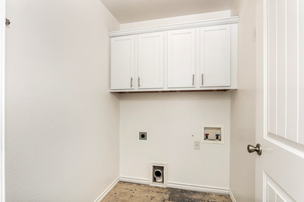 211 Green Oaks Loop Fredericksburg, TX 78624 - Photo 17 of 22 a view of cabinets with wooden floor
