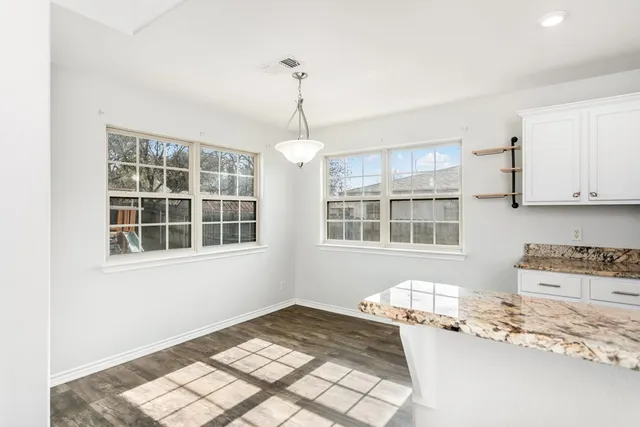 a very nice looking kitchen with a large window
