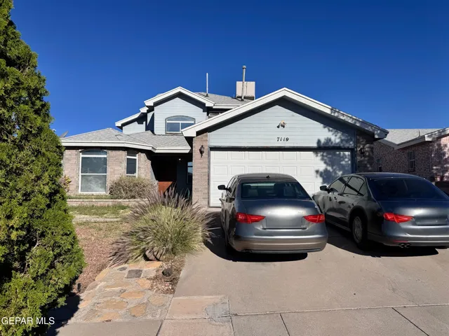 a view of a car in front of house