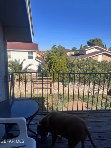 a view of a house with backyard porch and wooden floor