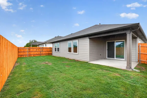 a backyard of a house with lots of green space