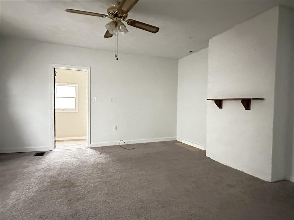 259 High Street Mount Pleasant, PA 15666 - Photo 3 of 19 an empty room with windows and closet