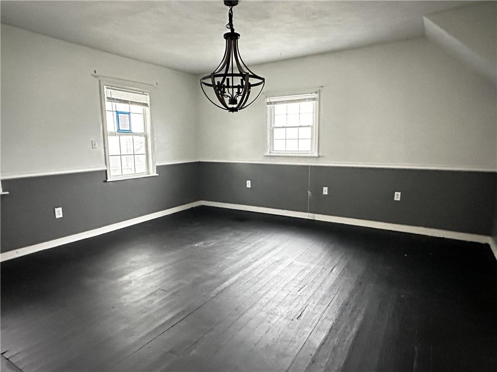 259 High Street Mount Pleasant, PA 15666 - Photo 5 of 19 an empty room with wooden floor and windows