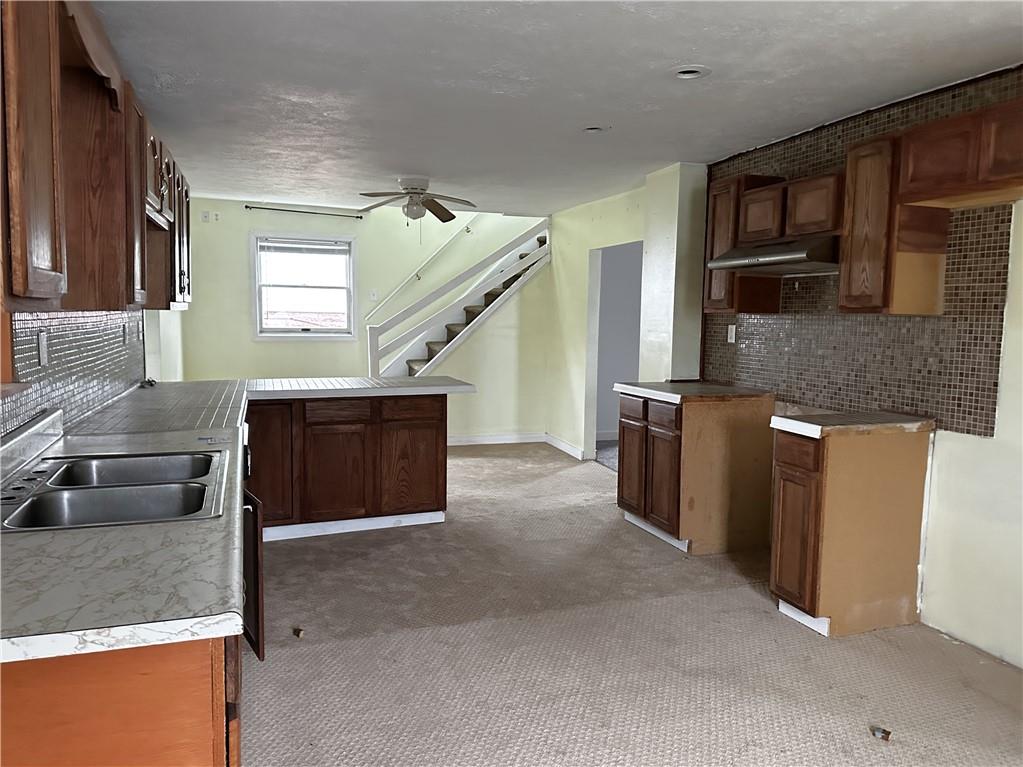 259 High Street Mount Pleasant, PA 15666 - Photo 7 of 19 a kitchen with a stove and a microwave