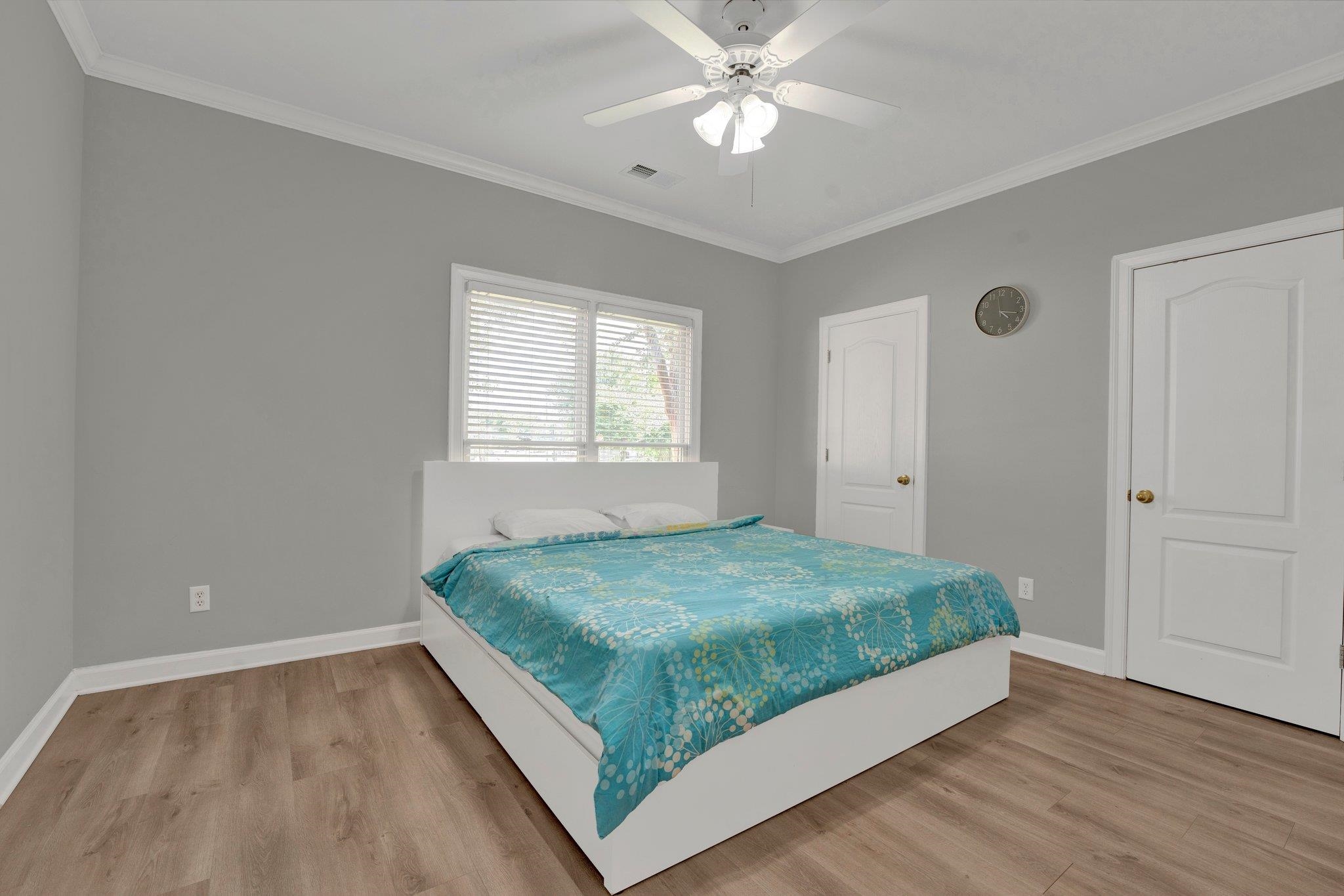 1331 Riding Brook Drive Collierville, TN 38017 - Photo 24 of 39 Bedroom with hardwood / wood-style flooring, ornamental molding, and ceiling fan