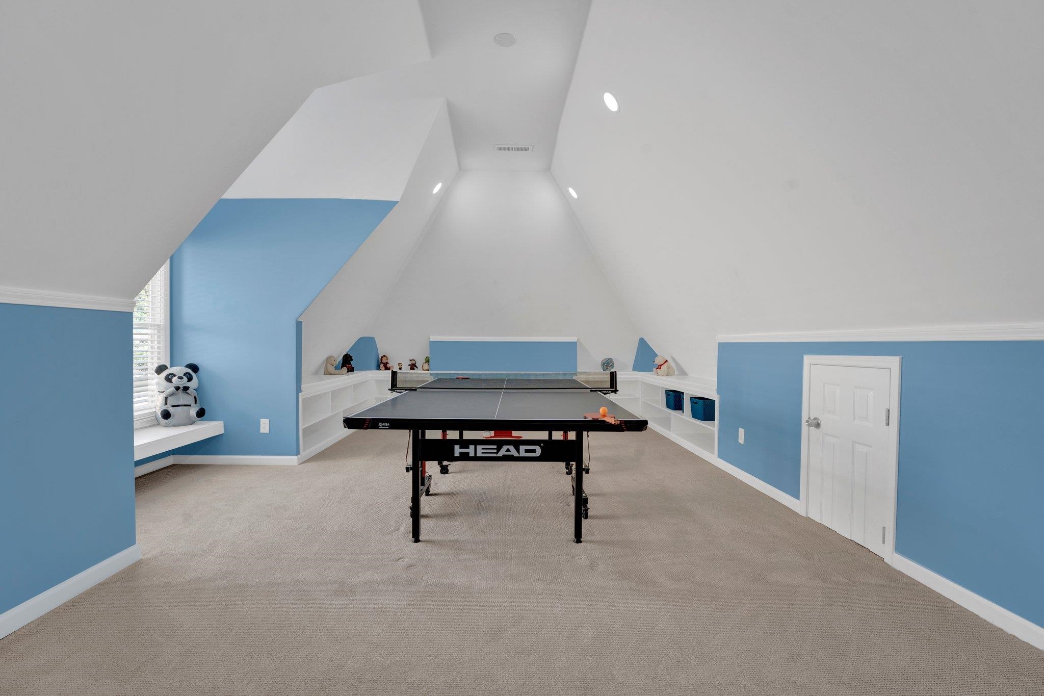 1331 Riding Brook Drive Collierville, TN 38017 - Photo 31 of 39 Playroom with lofted ceiling and carpet floors