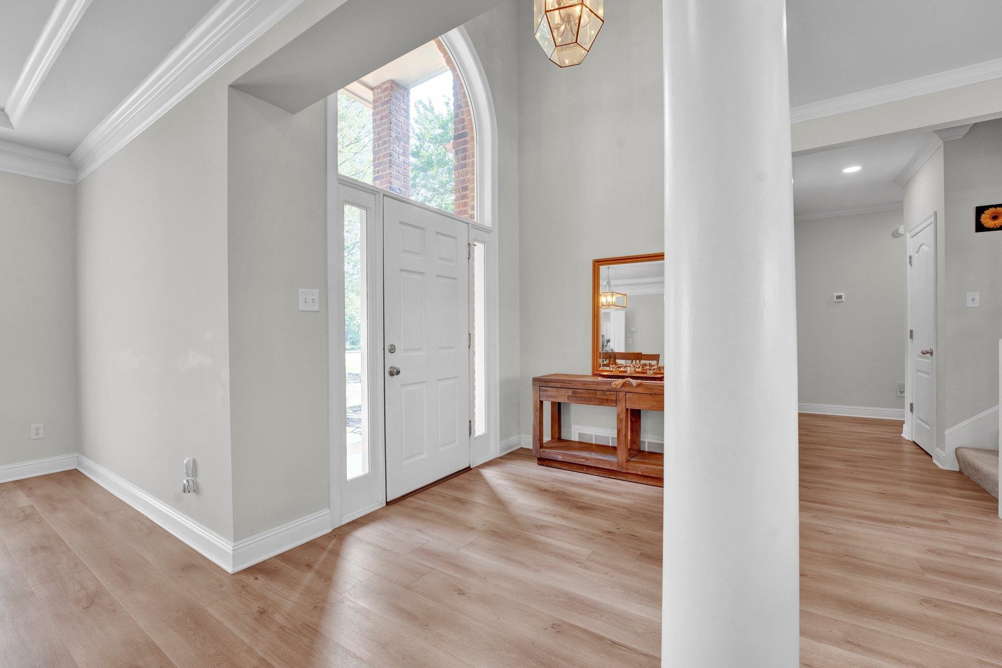1331 Riding Brook Drive Collierville, TN 38017 - Photo 6 of 39 Foyer featuring light hardwood / wood-style floors and ornamental molding