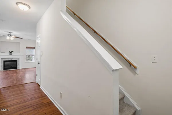 a view of hallway with wooden floor