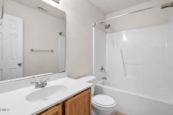 a bathroom with a sink a toilet and a bathtub
