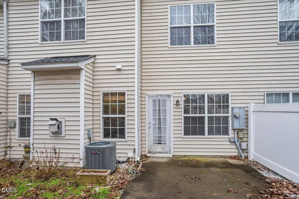a front view of a house with large windows