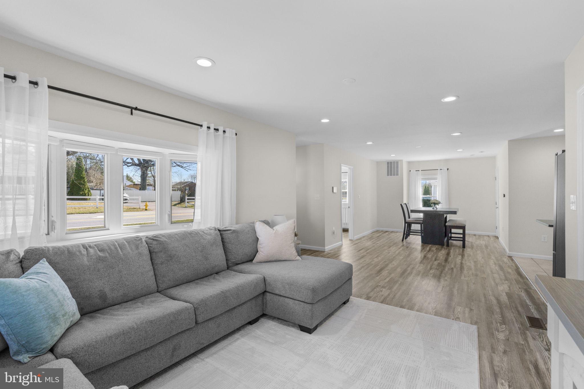 8062 Telegraph Road Severn, MD 21144 - Photo 10 of 45 a living room with furniture and a large window