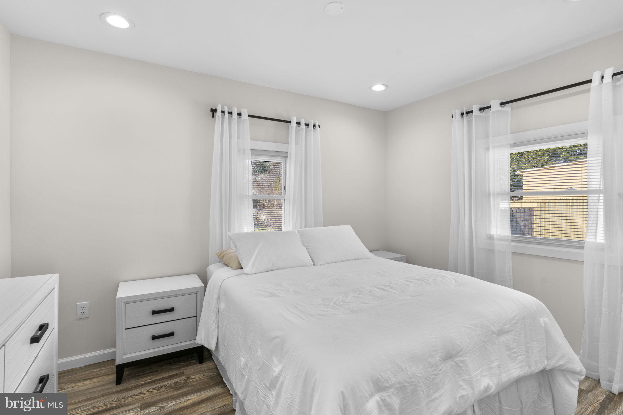 8062 Telegraph Road Severn, MD 21144 - Photo 16 of 45 a bedroom with a bed and a window