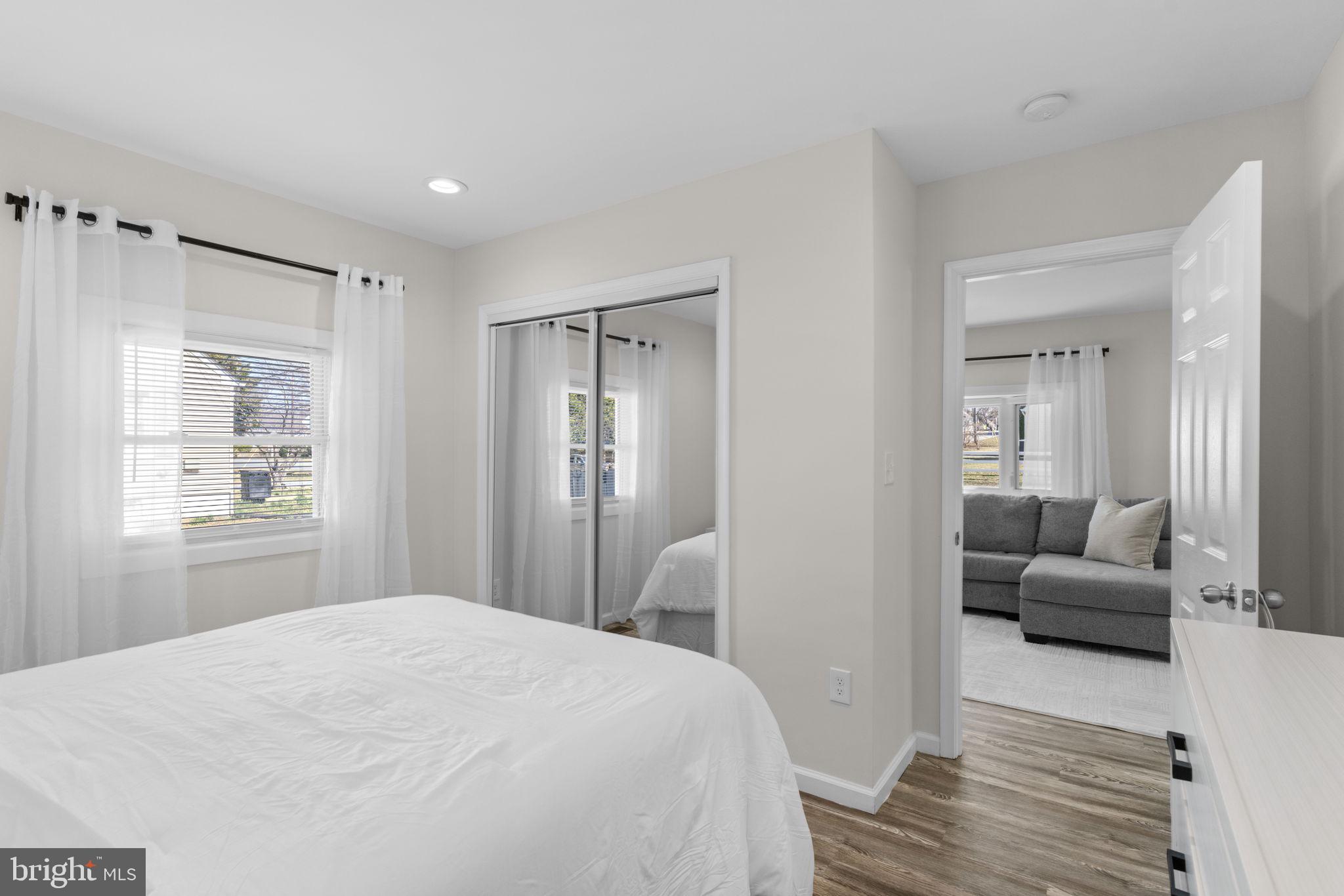 8062 Telegraph Road Severn, MD 21144 - Photo 17 of 45 a bedroom with a bed and wooden floor