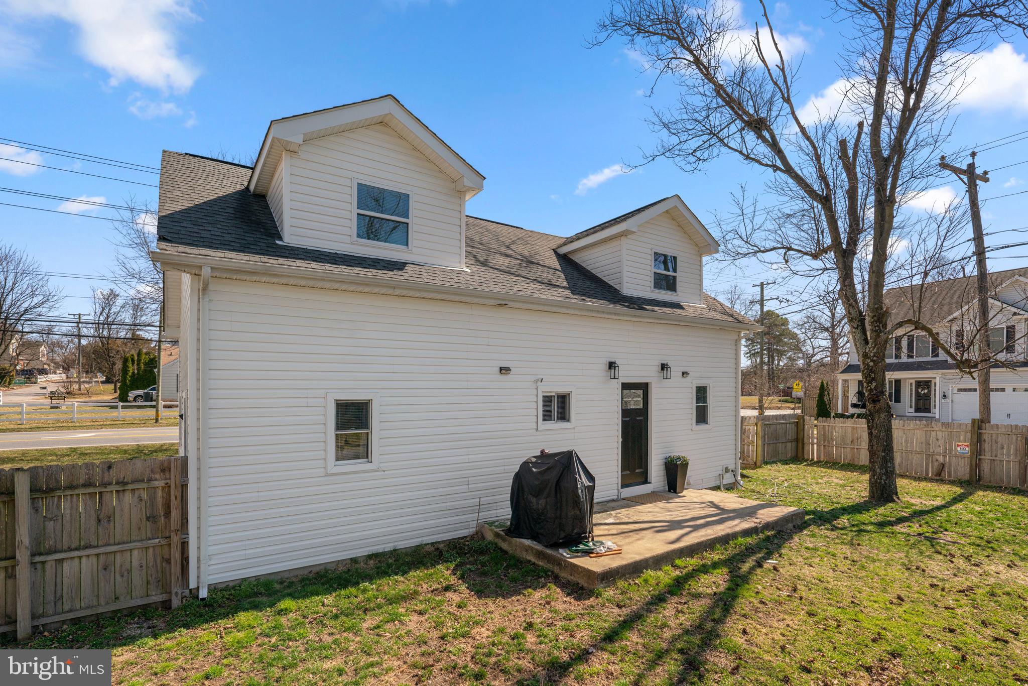 8062 Telegraph Road Severn, MD 21144 - Photo 38 of 45 a view of a house with a yard