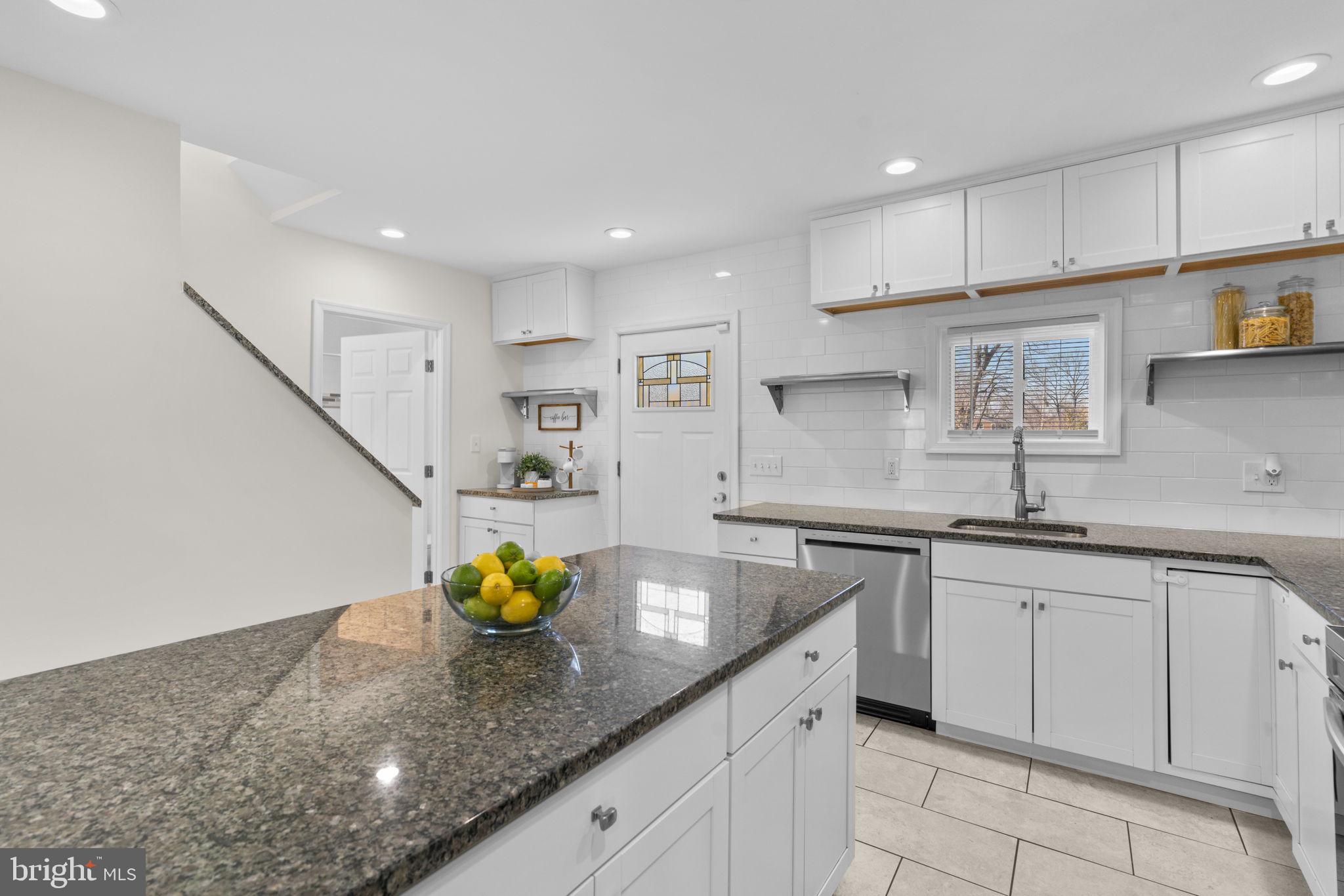8062 Telegraph Road Severn, MD 21144 - Photo 4 of 45 a kitchen with white cabinets a sink and dishwasher