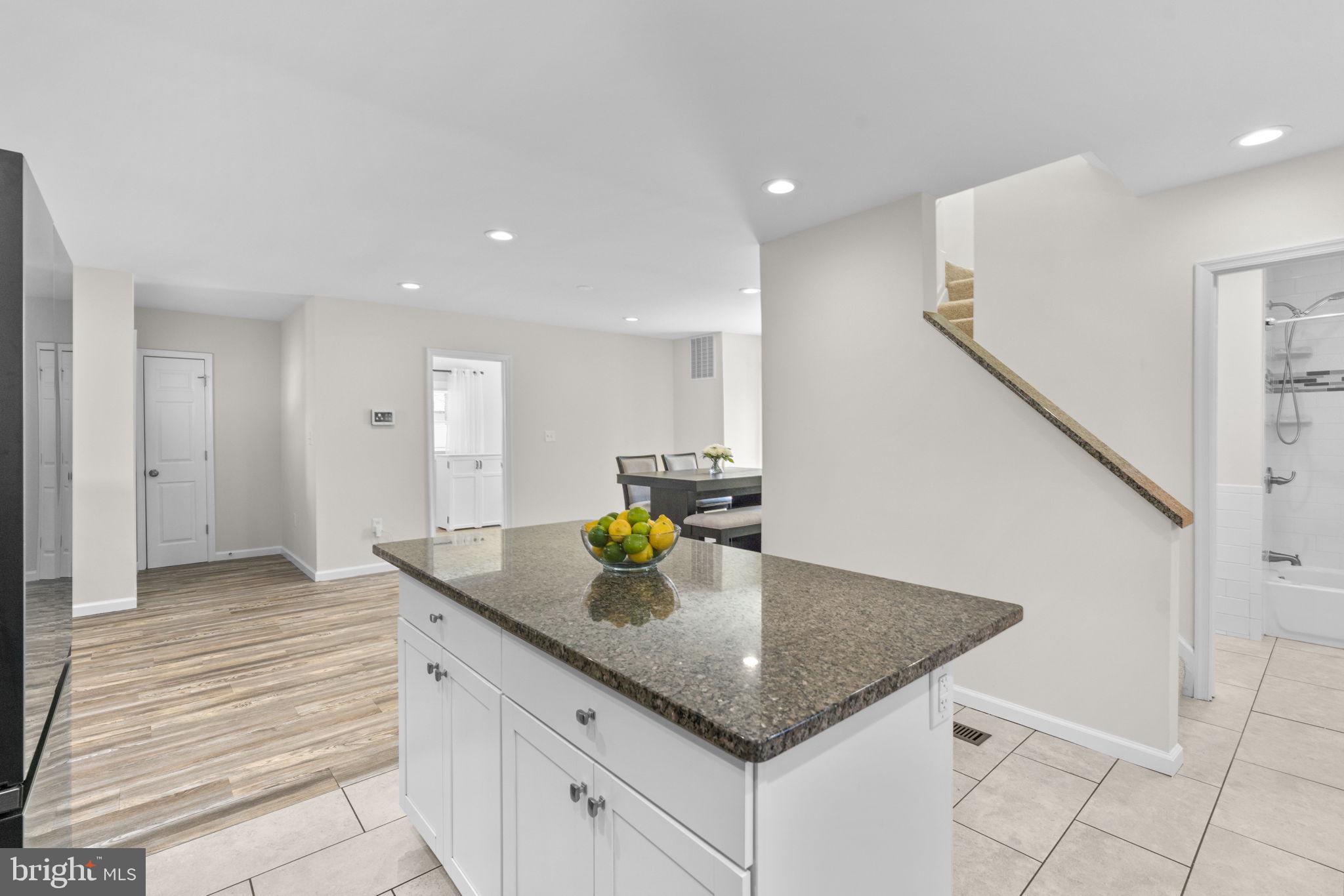 8062 Telegraph Road Severn, MD 21144 - Photo 5 of 45 a kitchen with kitchen island a counter top space and cabinets