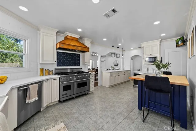 a kitchen with a stove and a sink