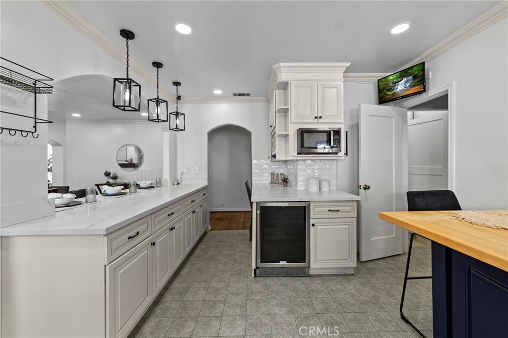 1697 Allen Avenue Pasadena, CA 91104 - Photo 16 of 58 a kitchen with kitchen island granite countertop a sink stove and cabinets