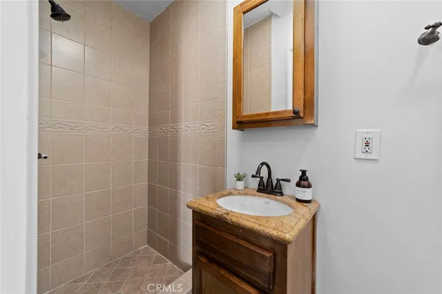 a bedroom with a bed and a mirror