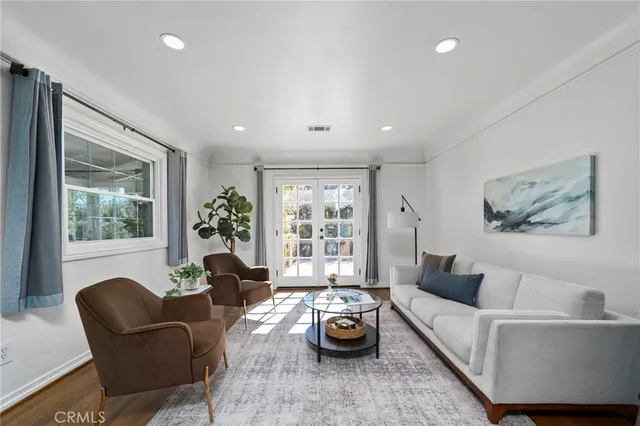 a living room with furniture a window and a fireplace