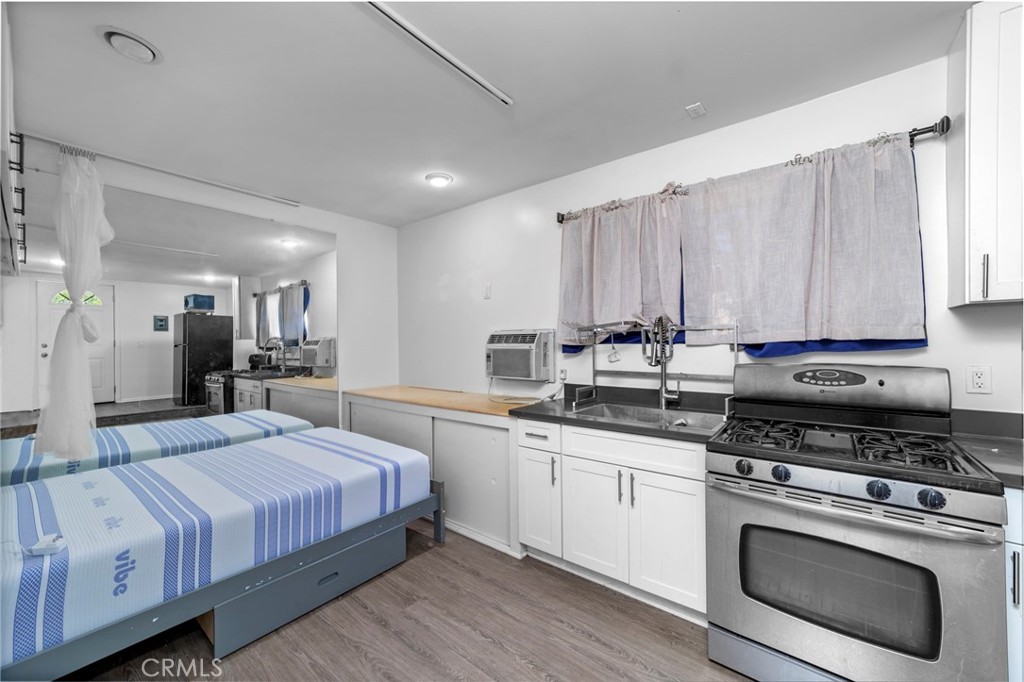 1697 Allen Avenue Pasadena, CA 91104 - Photo 33 of 58 a kitchen with a sink stove and cabinets