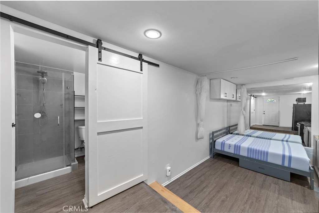 1697 Allen Avenue Pasadena, CA 91104 - Photo 34 of 58 a bedroom with a bed and a mirror