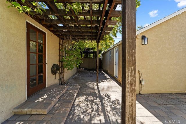 a view of backyard with potted plants and a potted plant
