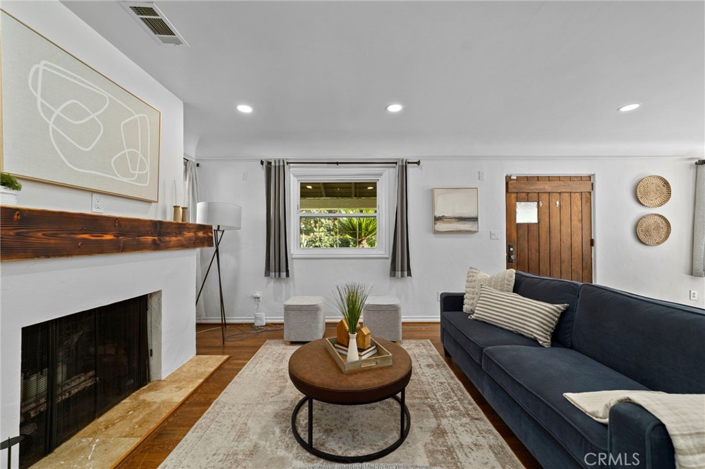 1697 Allen Avenue Pasadena, CA 91104 - Photo 6 of 58 a living room with furniture a window and a fireplace