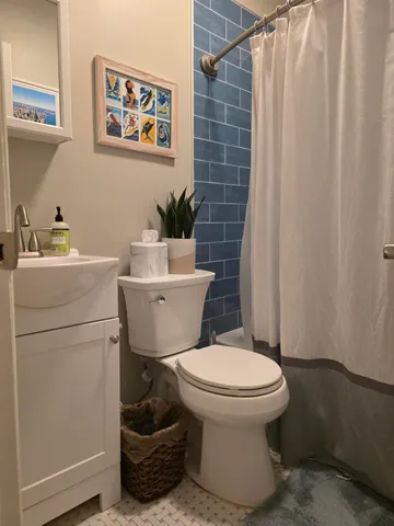 a bathroom with a toilet and a sink