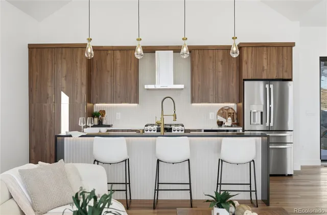 a spacious bedroom with a bed and wooden floor