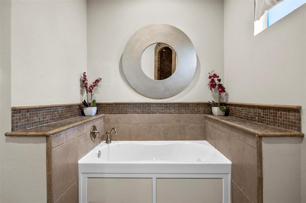 219 Mohundro Road Ferris, TX 75125 - Photo 22 of 40 a bathroom with a sink and a mirror
