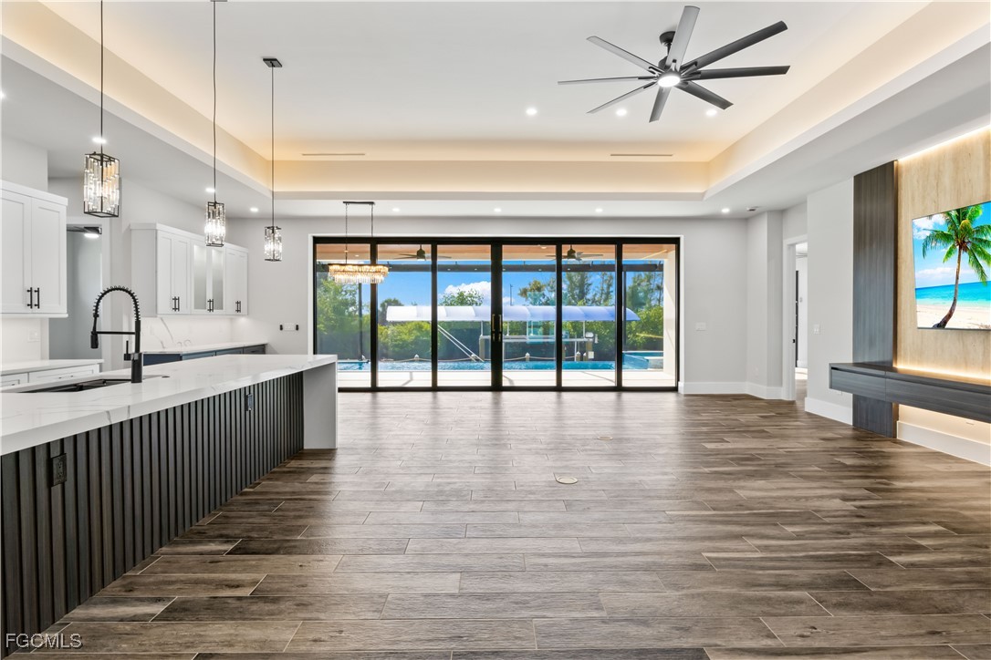 3906 Southwest 6th Terrace Cape Coral, FL 33991 - Photo 11 of 50 a view of a kitchen with a sink and wooden floor