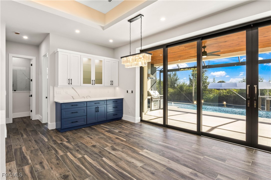 3906 Southwest 6th Terrace Cape Coral, FL 33991 - Photo 14 of 50 a bathroom with a double vanity sink and mirror