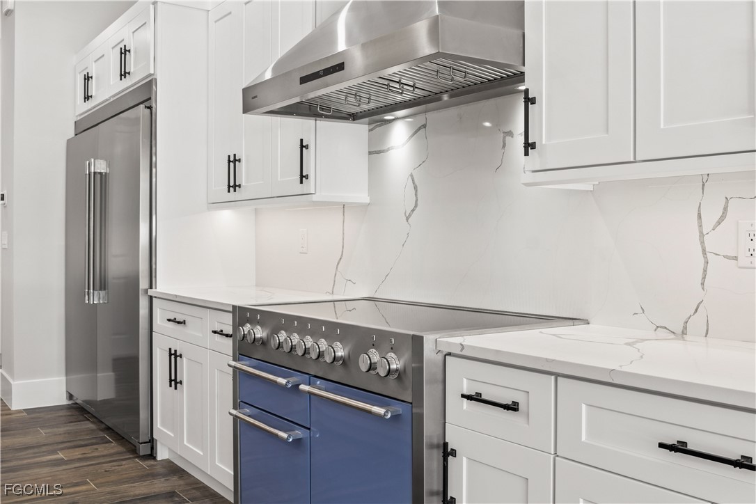 3906 Southwest 6th Terrace Cape Coral, FL 33991 - Photo 19 of 50 a kitchen with a stove and a refrigerator