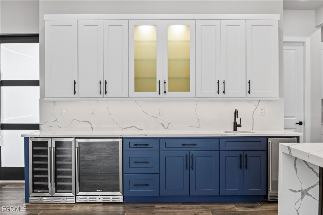 3906 Southwest 6th Terrace Cape Coral, FL 33991 - Photo 20 of 50 a kitchen with stainless steel appliances granite countertop cabinets and window