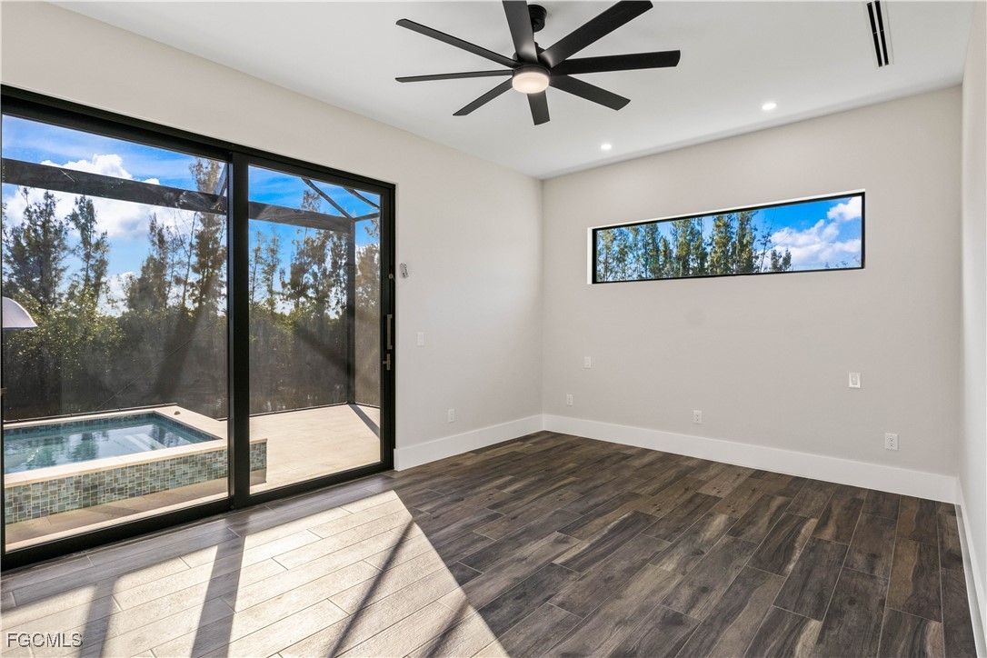 3906 Southwest 6th Terrace Cape Coral, FL 33991 - Photo 23 of 50 a view of a big room with wooden floor and windows