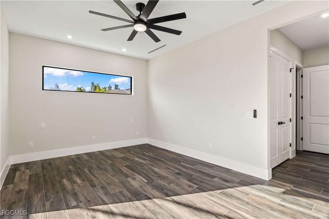 3906 Southwest 6th Terrace Cape Coral, FL 33991 - Photo 24 of 50 a view of a hallway with wooden floor