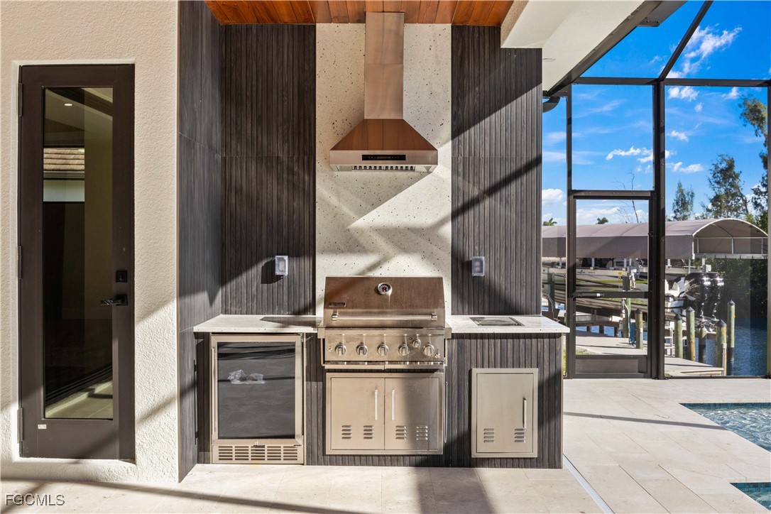 3906 Southwest 6th Terrace Cape Coral, FL 33991 - Photo 40 of 50 a stove top oven sitting inside of a kitchen