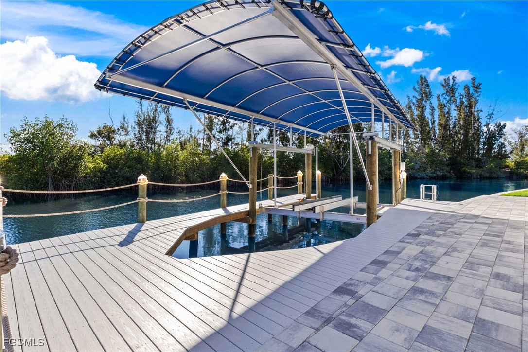 3906 Southwest 6th Terrace Cape Coral, FL 33991 - Photo 43 of 50 a view of house with swimming pool and sitting area