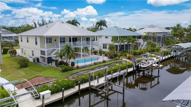 an aerial view of a house with garden space and patio