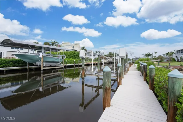 an aerial view of a house with yard swimming pool and outdoor seating