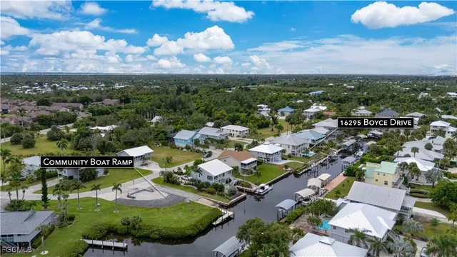 a view of a swimming pool and outdoor seating
