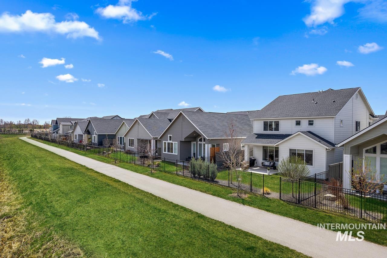 6216 South Wayland Way Meridian, ID 83642 - Photo 36 of 38 Rear exterior featuring a patio, fenced backyard, and mature landscaping