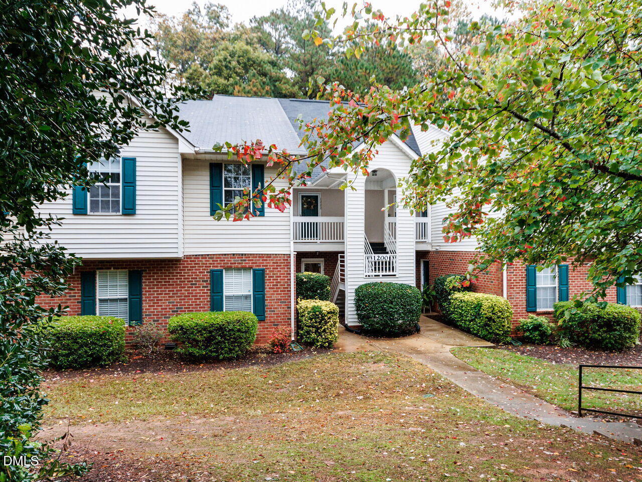 1221 Renshaw Court Cary, NC 27518 - Photo 1 of 29 a front view of a house with a yard and garage